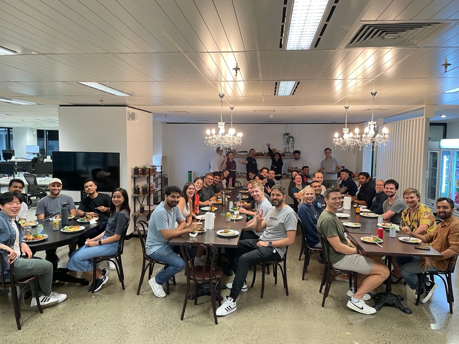 The Swipejobs team sharing a dinner together in the office